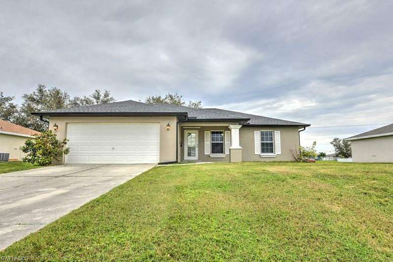 View of front of property with a front yard