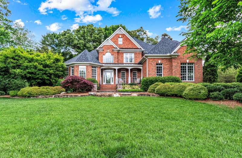 Corner view of beautiful landscaping and angles of house
