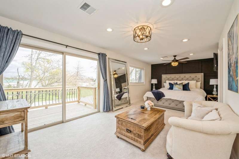 01-Huge Master Bedroom Overlooks Deck