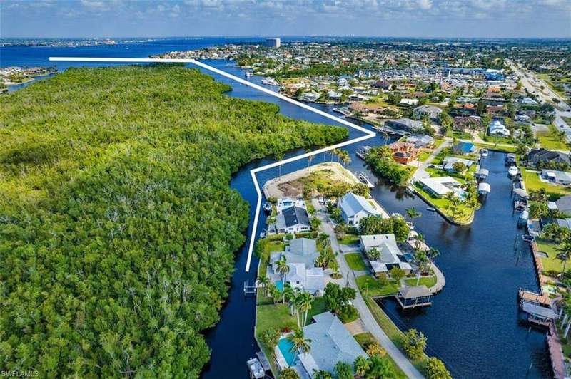 Drone / aerial view featuring a residential view and a water view