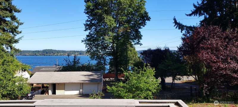 From inside your great room enjoy seeing the waters of Dyes Inlet everyday.