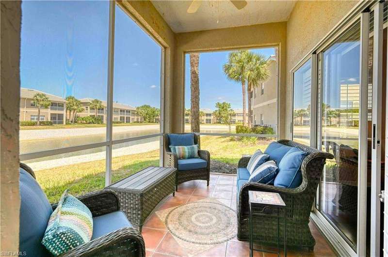 Sun flows over lake into screened and tiled lanai